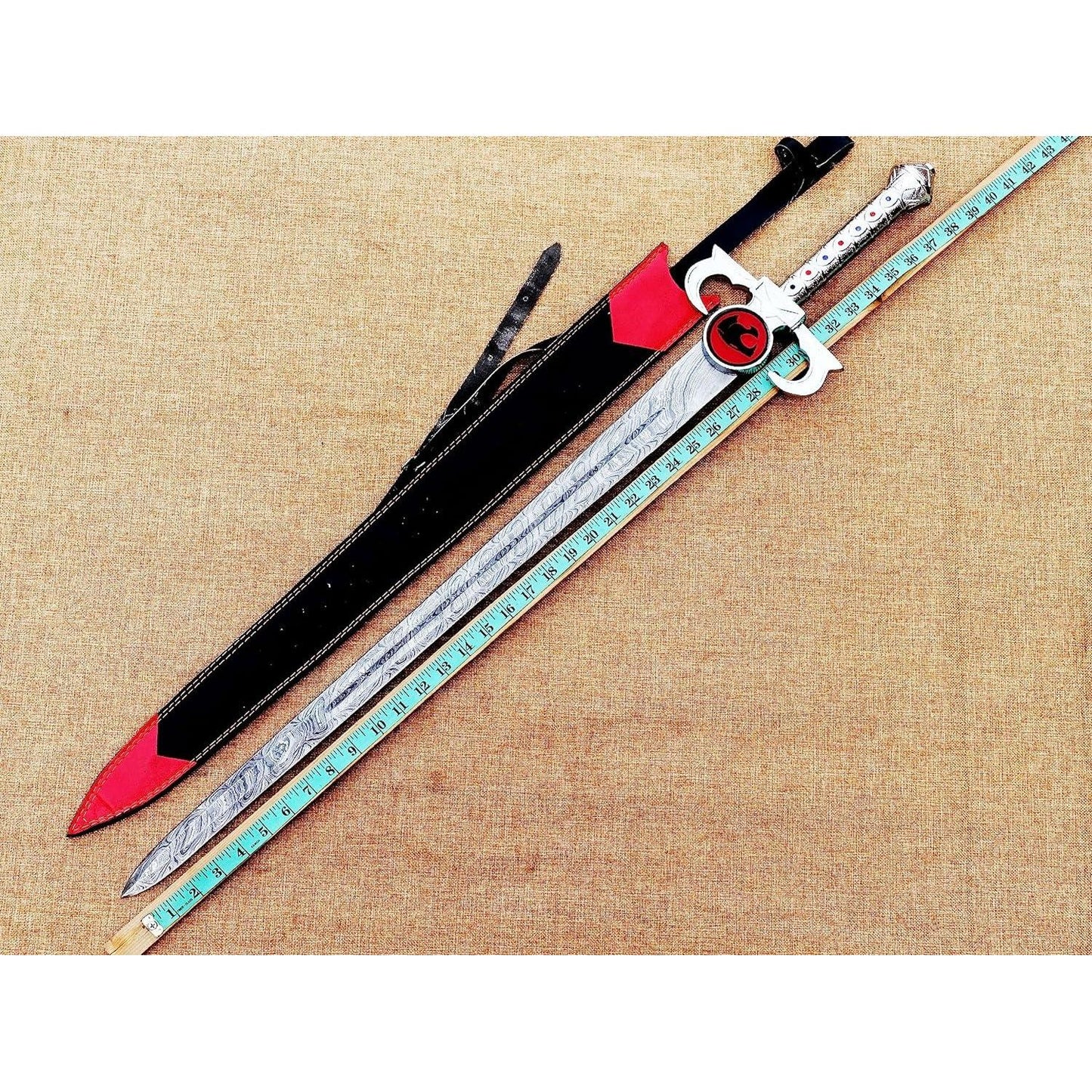 ThunderCats Lion-O inspired Damascus sword featuring patterned Damascus steel blade, fantasy guard, and detailed handle inspired by the legendary Sword of Omens